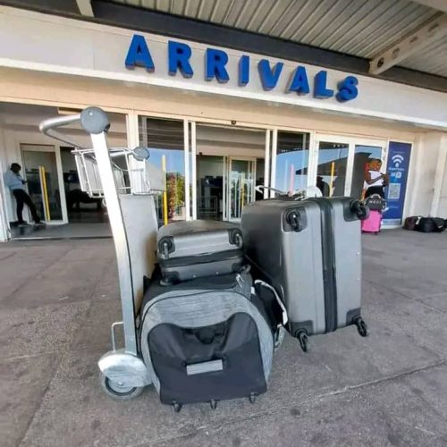 Smartphone showing flight details and car keys